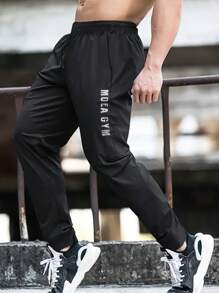 Manfinity Sport Corelite 男友风男士字母图案抽绳腰运动裤 - 黑色 - 查看 1