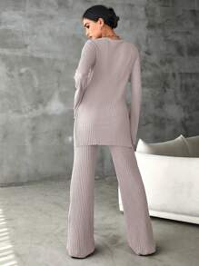 RueChic Camiseta de algodón unicolor con bajo dividido y pantalones acampanados