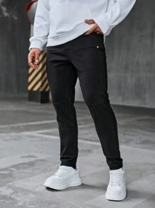 Manfinity Homme Pantalones slim fit de color negro sólido para hombres con diseño de cremallera, detalles de bolsillo simulado y costuras, de estilo casual - Negro - Ver 1