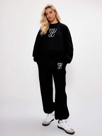 MUSERA Pantalones de chándal con puños y logotipo bordado, para vacaciones y aeropuerto, casuales