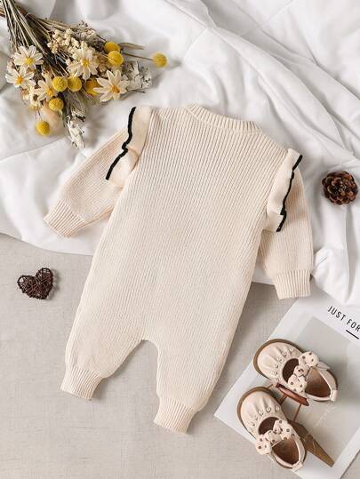 Souflis Souflis Bộ đồ liền thân màu be cho bé gái là trang phục thanh lịch và thời trang. Màu sắc nhẹ nhàng phù hợp với nhiều dịp khác nhau.
