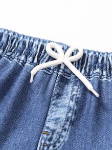 SHEIN 年轻男孩休闲抽绳腰带字母和笑脸印花慢跑裤，时尚春秋街头服饰