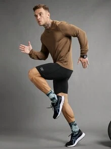 Manfinity Sport Polished Pantaloncini sportivi aderenti da uomo con fascia in costina a righe