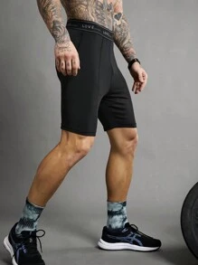 Manfinity Sport Polished Pantaloncini sportivi aderenti da uomo con fascia in costina a righe
