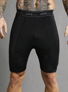 Manfinity Sport Polished Pantaloncini sportivi aderenti da uomo con fascia in costina a righe