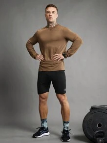 Manfinity Sport Polished Pantaloncini sportivi aderenti da uomo con fascia in costina a righe