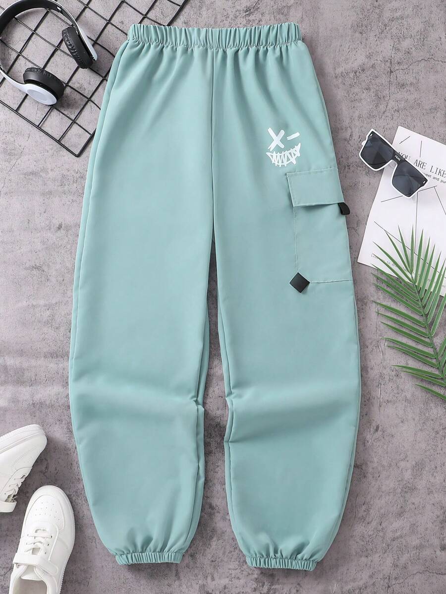 SHEIN Explorewe Spodnie casualowe dla nastolatków/młodych chłopców z nadrukiem uśmiechniętej twarzy, modne spodnie robocze