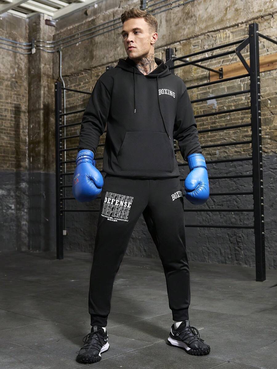 Manfinity Sport Corelite Freund-Stil Herren Pullover mit Kapuze und Schnürung, Langarm, Buchstaben-Muster, und Jogginghose, Sportanzug