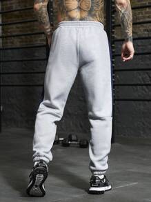 Manfinity Sport PWRUP Pantalones de chándal rectos y sueltos con estampado de letra y cordón en la cintura, estilo novio para hombre