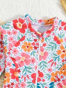 年轻女孩热带花卉印花拉链长袖休闲 T 恤款式连体泳衣