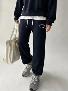 DAZY Bộ đồ nam 2 món gồm áo nỉ cổ lửng in chữ và quần ống rộng có dây rút, thích hợp cho mùa thu. - Màu xanh hải quân - Xem 6