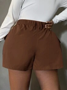 SHEIN SXY Pantalones cortos minimalistas de uso diario en unicolor con bolsillo delantero y botones, talla grande