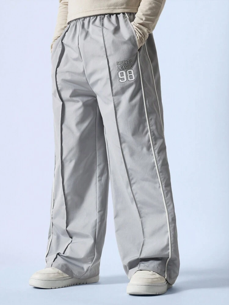 Pantaloni da tuta con gamba ampia per ragazze pre-adolescenti, con pieghe e dettagli di bordatura