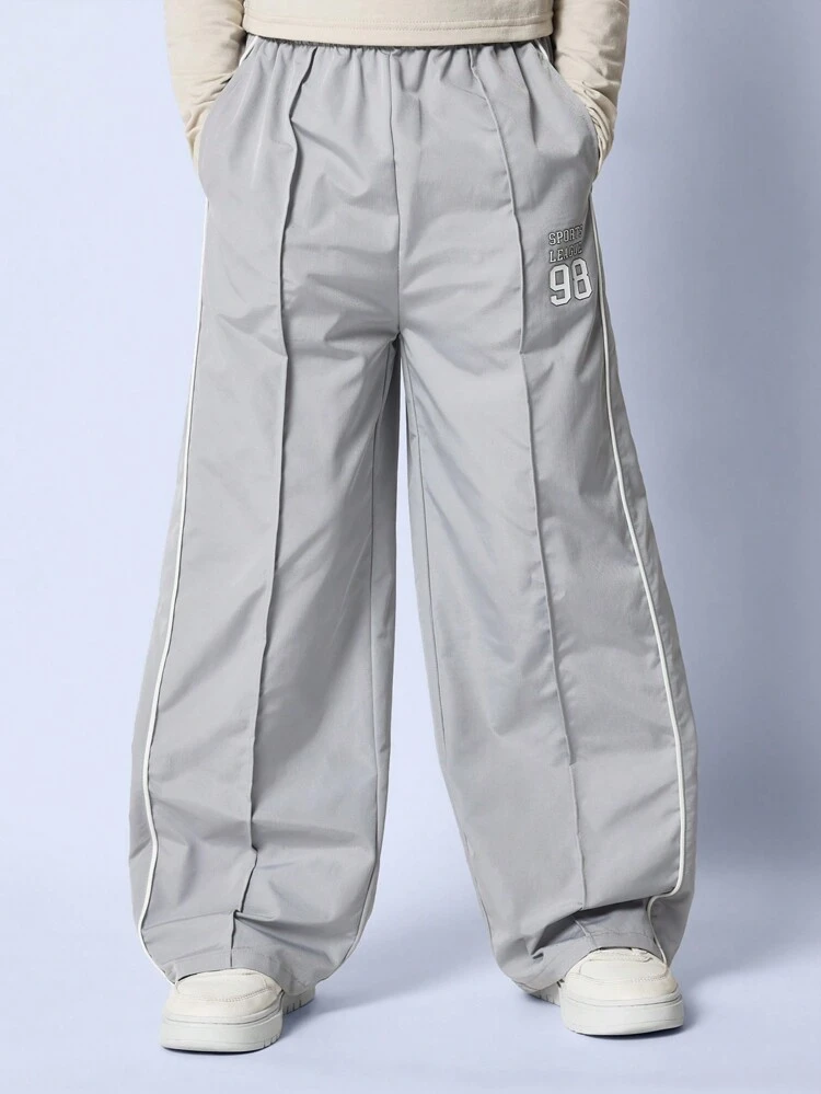 Pantaloni da tuta con gamba ampia per ragazze pre-adolescenti, con pieghe e dettagli di bordatura