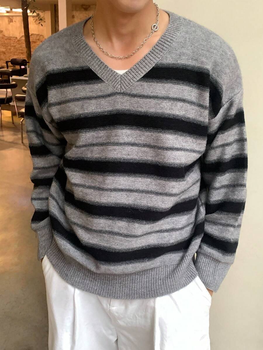 Manfinity Dauomo Jersey holgado de cuello en V a rayas de manga larga para hombre, otoño/invierno