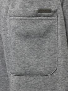 SUMWON Pantalones deportivos premium de ajuste suelto estilo jogger, cómodos y de forro polar para el invierno, para hacer ejercicio o descansar, con cordón y bolsillos laterales