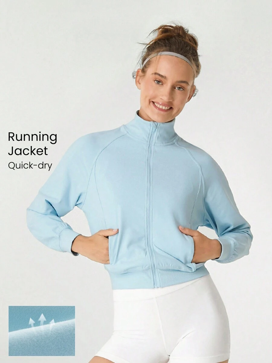 GLOWMODE Chaqueta reflectante para correr con cuello alto, mangas largas, bolsillos laterales, de tela elástica y absorbente de sudor para recorrer senderos - Celeste - Ver 1