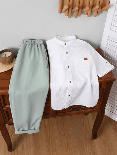 2 bucăți Tween Boys casual stil coreean cu gât rotund Cardigan cu mânecă scurtă, culoare solidă, cămașă cu buzunar cu plasture și pantaloni țesuti relaxați Set 2 bucăți, potrivit pentru școală, grădină, plajă, ziua de naștere, primăvară/vară/toamnă/iarnă