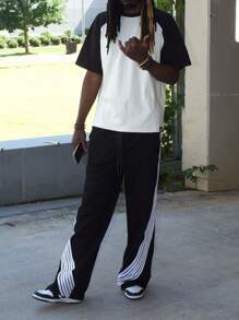 Manfinity Dauomo Men's Solid Color Patchwork Front Tie Casual Sweatpants, Daily Wear - Black and White - View 1