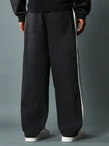 SUMWON Pantalones ajustados de campana de nailon con detalles de cinta