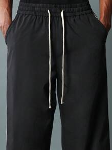 SUMWON Pantalones ajustados de campana de nailon con detalles de cinta