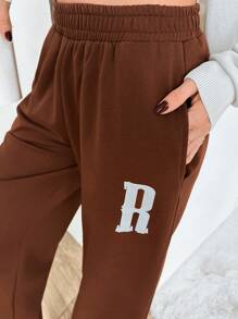 RueChic Brązowe spodnie dresowe damskie z niskim stanem i logo