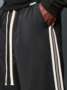 SUMWON Pantalones ajustados de campana de nailon con detalles de cinta