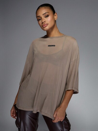 MISSGUIDED Camiseta túnica larga semitransparente de malla oversize, de manga corta, con etiqueta con logotipo, estilo callejero contemporáneo, básica y esencial para otoño e invierno