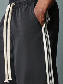 SUMWON Pantalones ajustados de campana de nailon con detalles de cinta