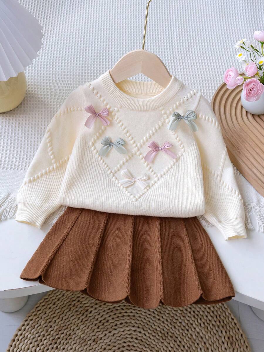 Souflis Souflis Baby Girls Warm Clothing Set, Baby Girls Winter Warm Knitted 2 Pieces Set, Adorable Bow Sweater & Pleated Skirt Outfit, Soft & Comfortable - Apricot - View 1