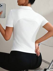 SHEIN Sport Studio Camisa polo deportiva casual de manga corta y unicolor para mujer