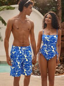 Manfinity VDAYZ 1 pieza Pantalón corto de playa holgado con estampado de planta tropical y cordón en la cintura para hombres, traje de baño a juego para parejas, estilo hawaiano