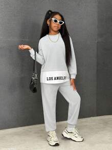 SHEIN Conjunto de chándal de niña preadolescente con parte superior de manga larga con cuello redondo y estampado de letras y colores en bloque, y pantalones de cintura elástica
