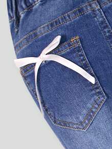 SHEIN Pantalones acampanados cómodos y elásticos con lazo para niñas, un elemento esencial y versátil