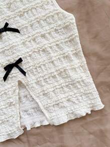 Soleia Top sin mangas de punto texturizado beige con lazo decorativo en la parte delantera y trasera con aberturas laterales, para fiestas y uso casual en resorts
