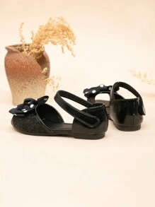 Sandalias planas tipo princesa para niñas con decoración de lazo de purpurina y punta abierta