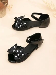 Sandalias planas tipo princesa para niñas con decoración de lazo de purpurina y punta abierta