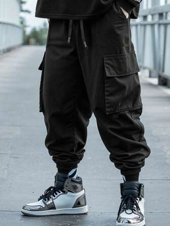 Manfinity Roghcode Pantalones jogger holgados con bolsillos cargo para hombre, otoño