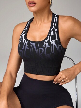 Top sin mangas con estampado de letras y espalda de cruce para yoga, gimnasio y entrenamiento de mujeres