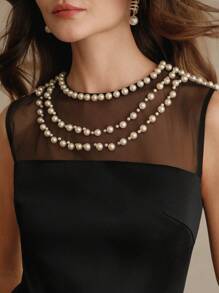 Anewsta Vestido ajustado de línea A con cintura, sin mangas, de malla con parches y cadena de perlas sintéticas en elegante estilo urbano, en color negro