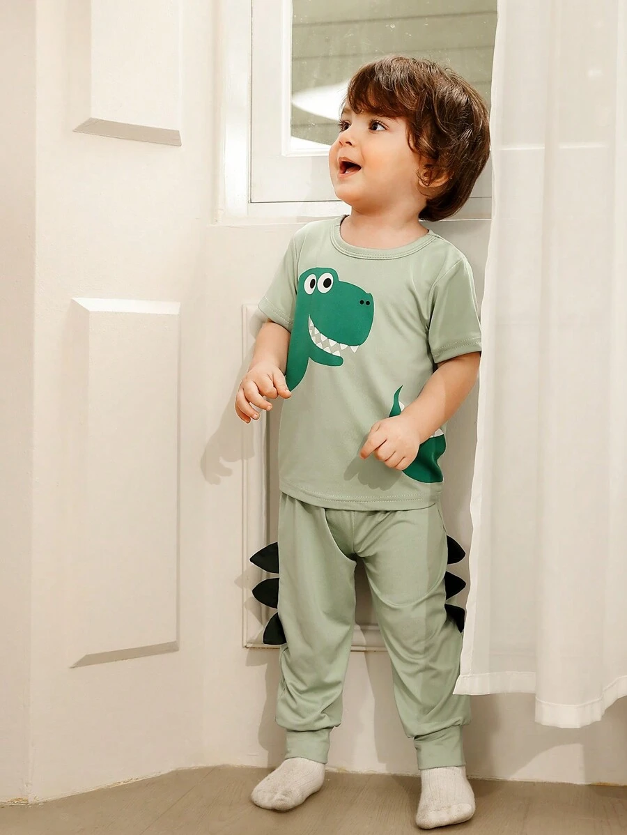 SHEIN 2pcs/Set Baby Boys Cartoon Dinosaur Print Short Sleeve Tee + Elastic Waist Long Pants, Soft Breathable Sports Outfit, Casual Wear For Spring - Green - View 1