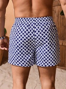 Manfinity Swimmode Shorts de playa con bolsillo delantero con cordón y estampado completo para hombres, casual de vacaciones, hawaiano