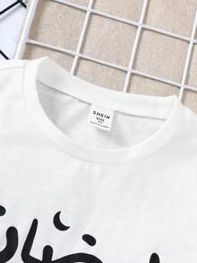 SHEIN Leap Crew 2pcs Young Boys Minimalist Crown Print Round Neck Short Sleeve T-Shirt And Plaid Pattern Pants Casual Comfortable Pajama Set, Suitable For Ramadan Holiday, Events, Family Gathering - Black and White - View 4