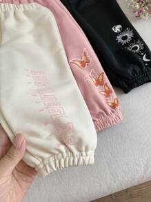 SHEIN Set de 3 pantalones de niña bebé con diseño de patrones de dibujos animados y cintura elástica, adecuados para otoño/invierno
