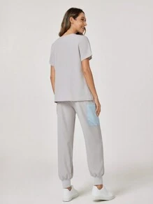 TaskEZ Solid Color Patchwork V-Neck Short Sleeve Minimalist Top And Pants Scrub Uniform Set