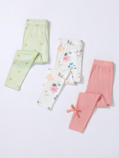 Set de 3 pantalones tipo leggings de longitud hasta el tobillo con estampado floral minimalista para niñas en combinación de blanco, verde claro y rosa