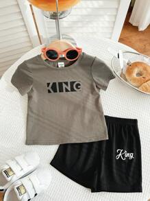 SHEIN Set de 2 piezas de top de manga corta de cuello redondo suave de punto y pantalones cortos de cintura elástica para bebé, niño o niña