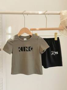 SHEIN Set de 2 piezas de top de manga corta de cuello redondo suave de punto y pantalones cortos de cintura elástica para bebé, niño o niña