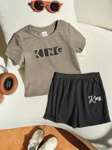 SHEIN Set de 2 piezas de top de manga corta de cuello redondo suave de punto y pantalones cortos de cintura elástica para bebé, niño o niña