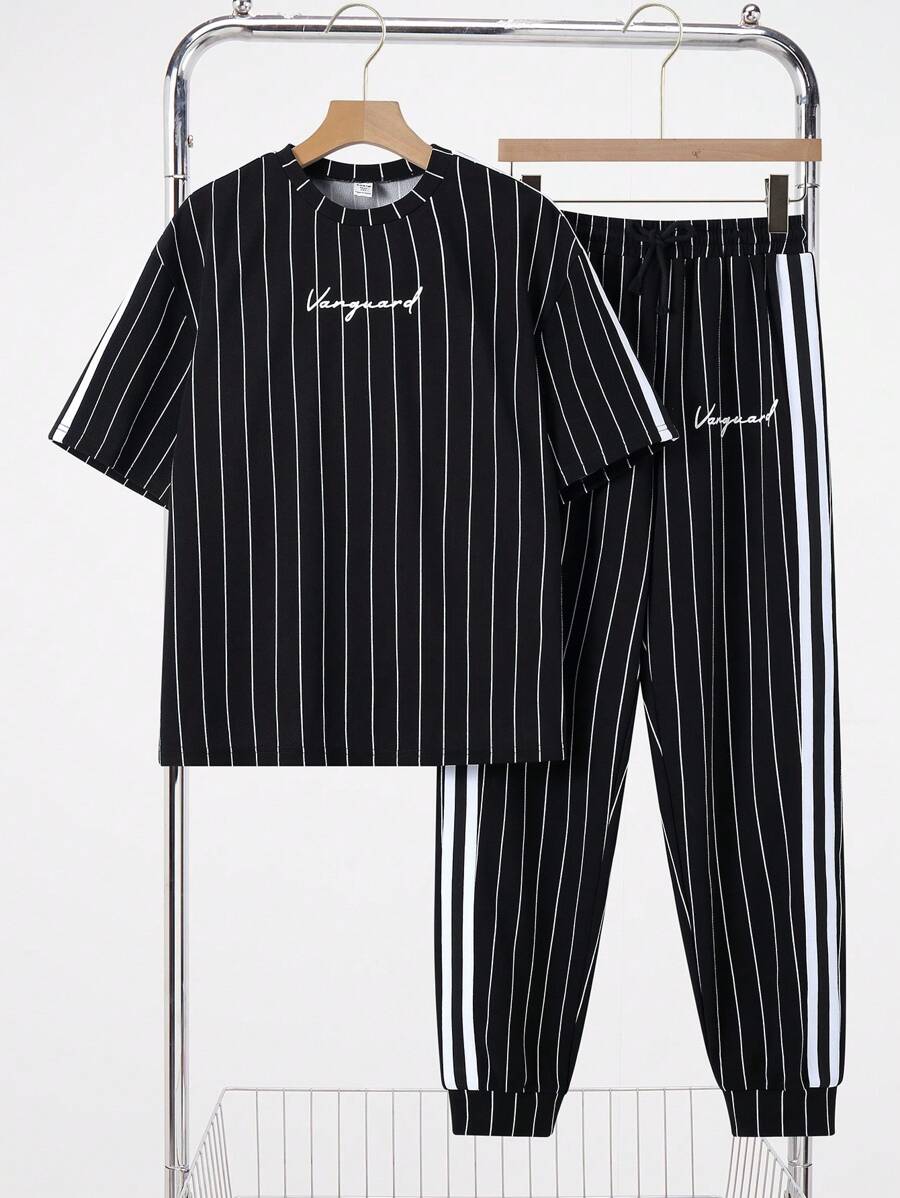 SHEIN Leap Crew 2pcs Set Teen Boy'sCasual Splicing Colour Collision Ribbons Black And White Vertical Stripes With Handwritten Letters In English Printed Round Neck Short Sleeve T-Shirt Trousers Two-Piece Set;Spring Wear; Teen Boys' Clothing; Teen Boy' Jackets, Spring Back To School - Black - View 1